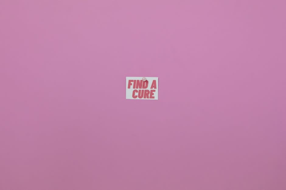Minimalistic pink background with 'Find a Cure' message. Perfect for health awareness campaigns.